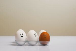 Three white eggs and a red egg.