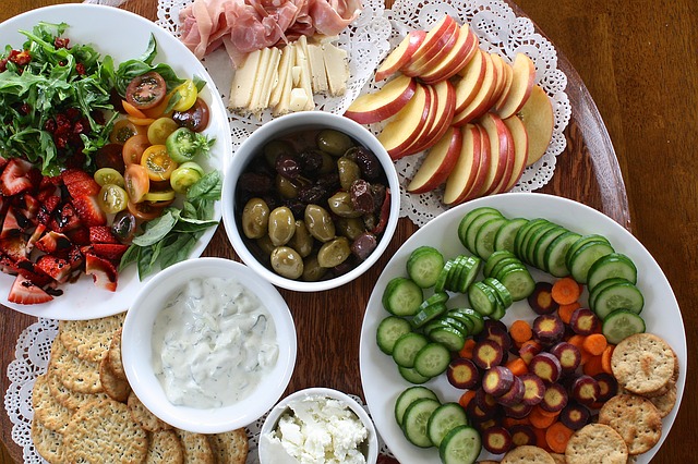 Fruit, olives, ham, cheese, and other appetizers.