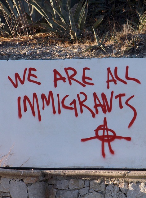 Graffiti with the message We are all immigrants.