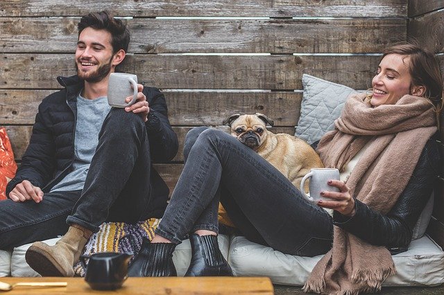 Young man and woman talking and laughing.