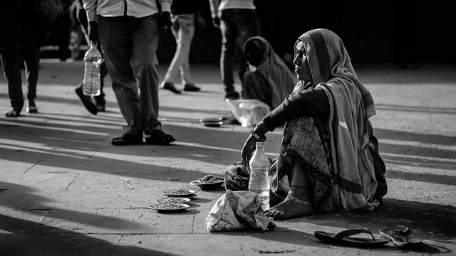 Poor woman begging on the street.