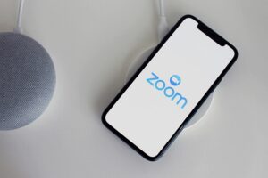 A cellphone with the Zoom logo in it.