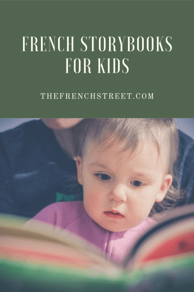 A little kid looking at a book.